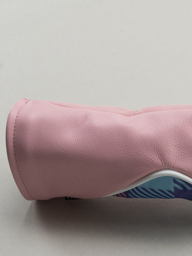 Pink golf club head cover with a pink yellow and blue plaid window