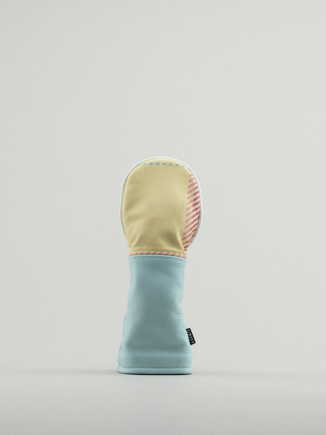 Golf club headcover made of pink, yellow and blue plaid with a blue leather base.