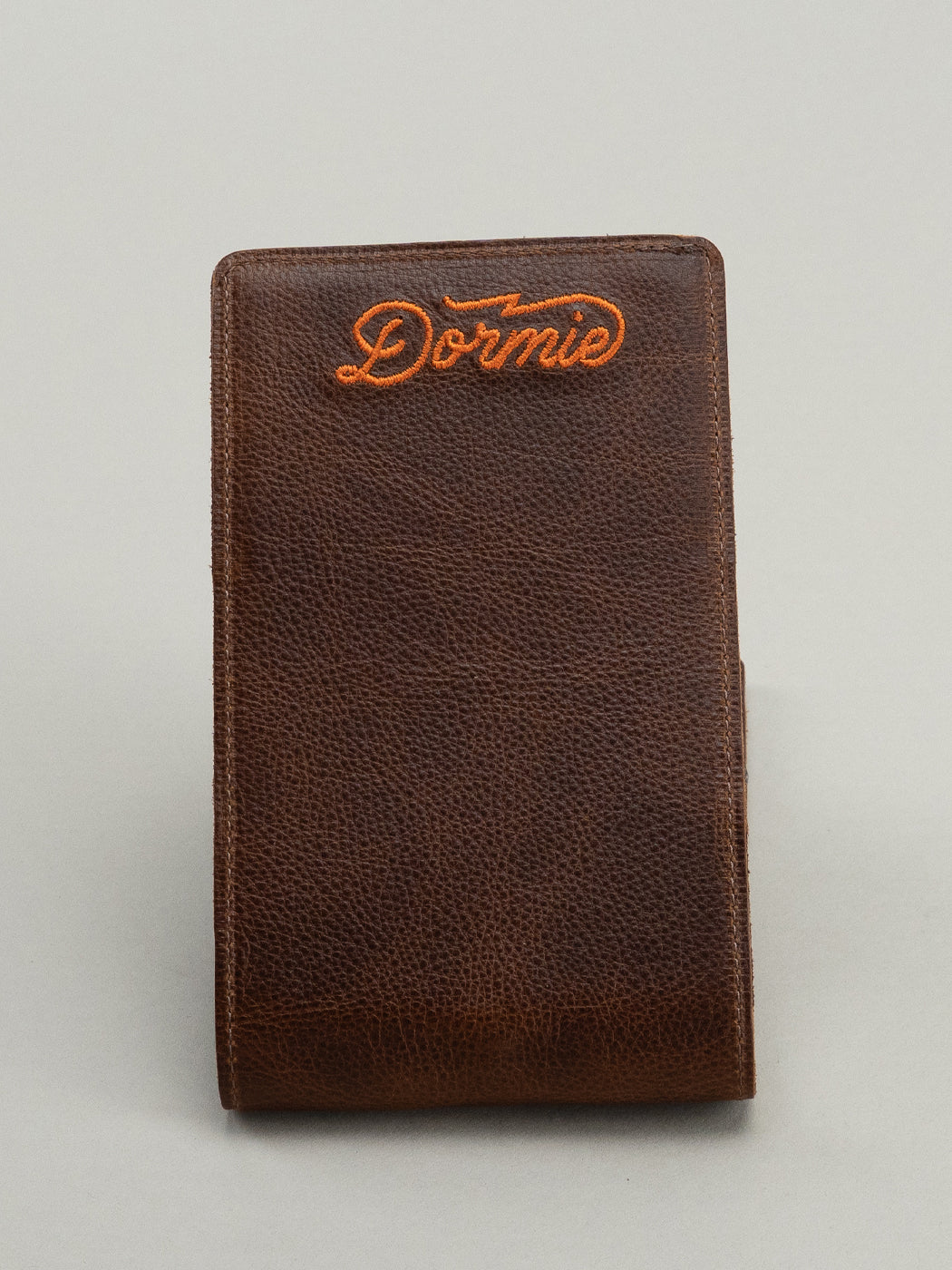 Brown leather yardage book with Dormie embroidery