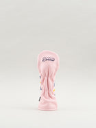 Pink golf club head cover with 'Dormie' branding in cursive font